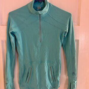 Ivivva long sleeved 1/4 zip turqoise shirt.